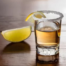 Tequila shot and slice of lemon ai